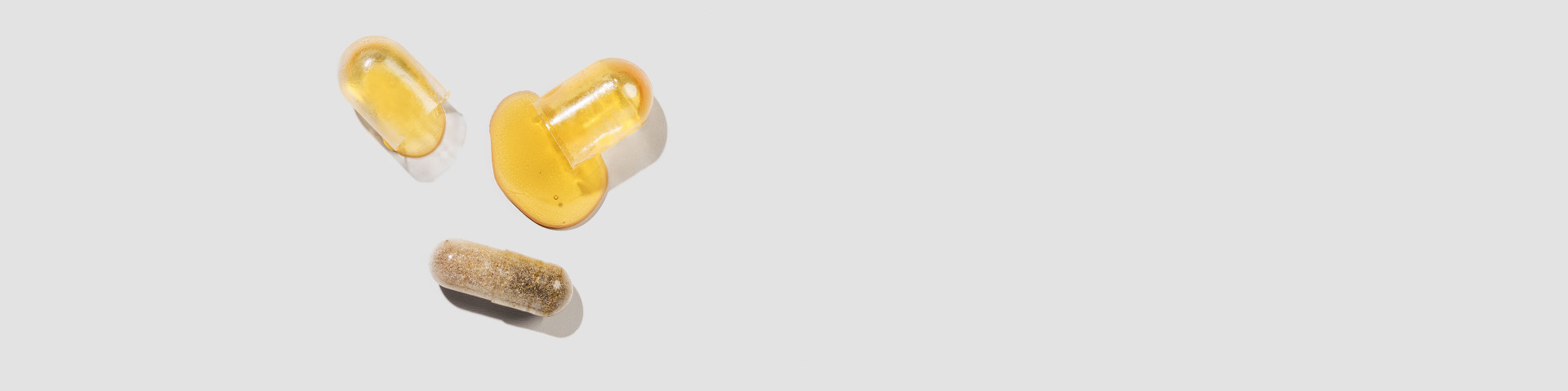 An opened capsule of Ritual's prenatal vitamin with DHA.