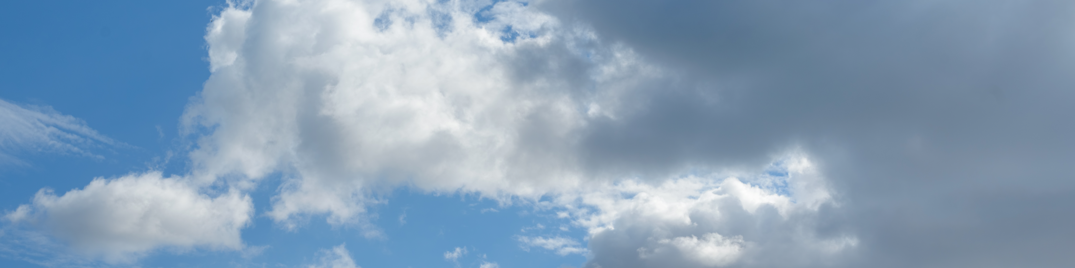 Few clouds over a blue sky.