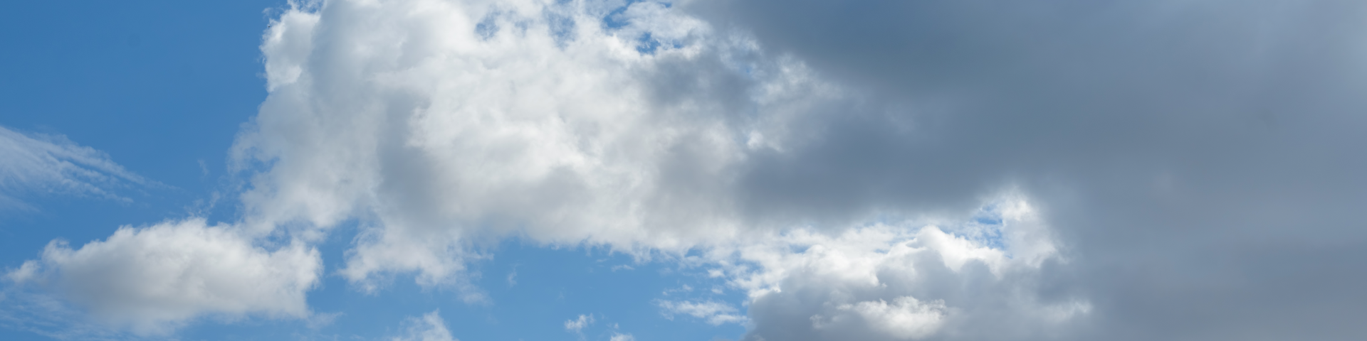 Few clouds over a blue sky.